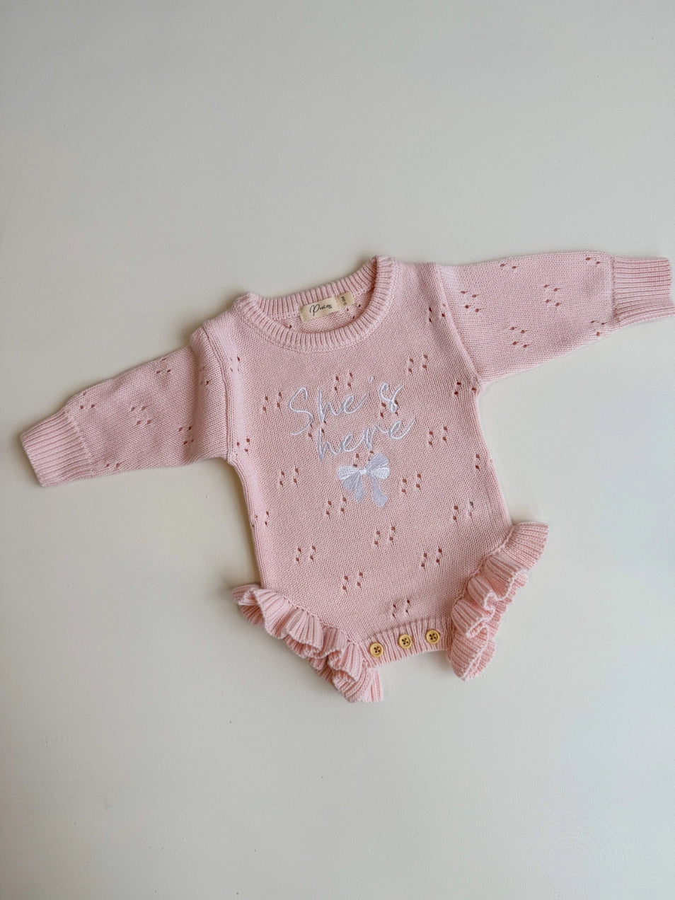 She's Here Bow - Pointelle Frill Romper | Baby Pink